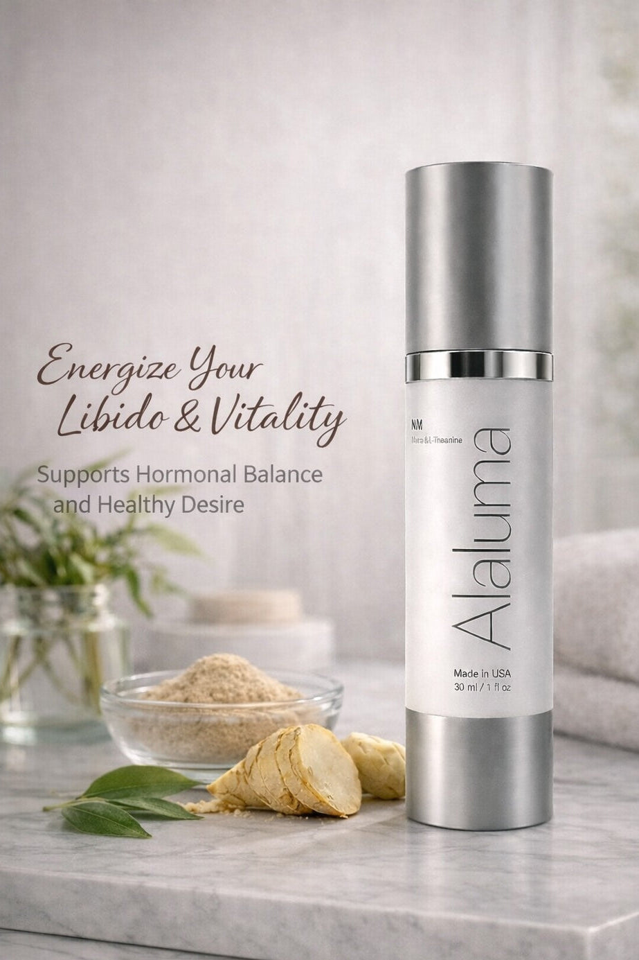 Alaluma skincare bottle on a marble surface with natural elements