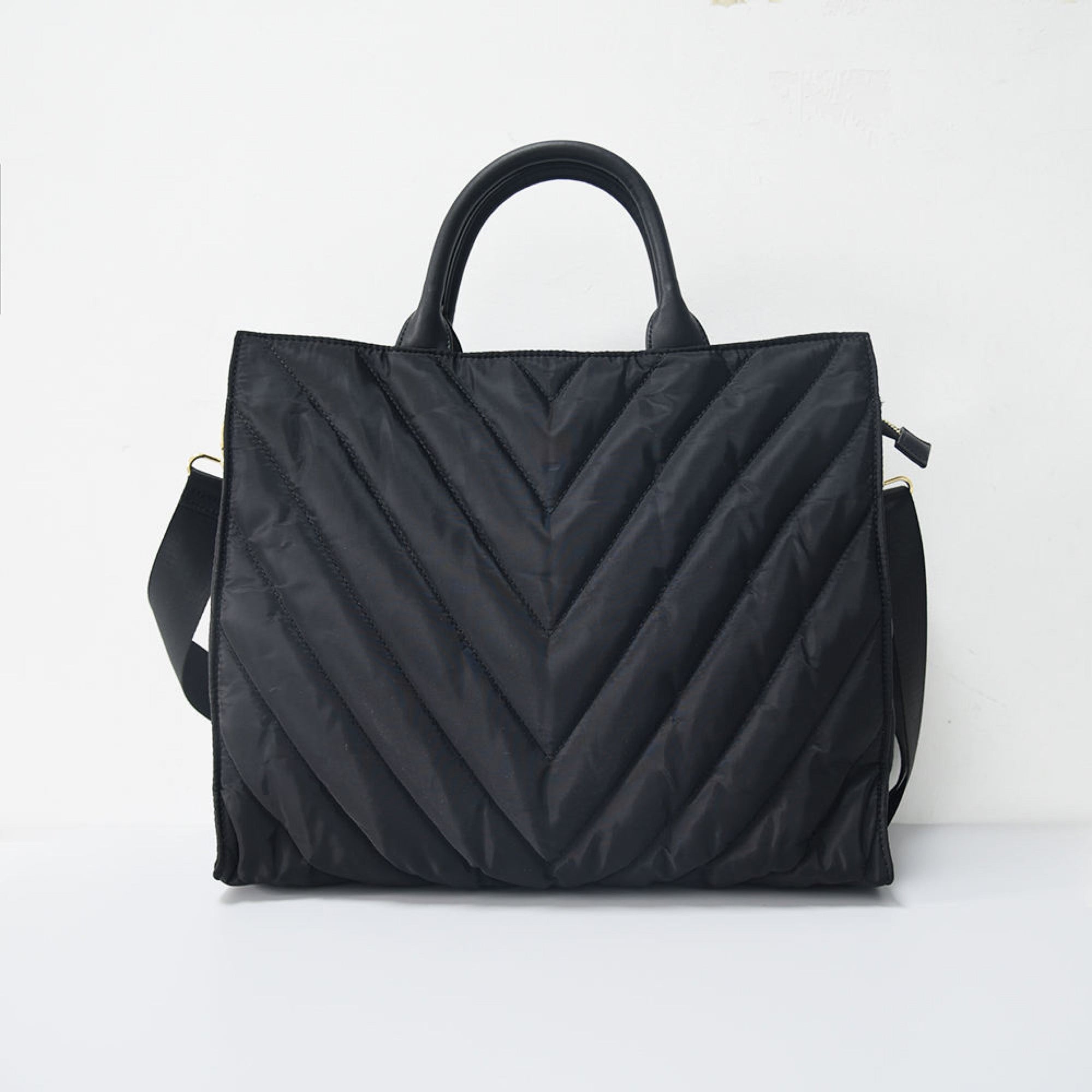 Carmen Puffer Tote interior showing two slip pockets and zippered pocket