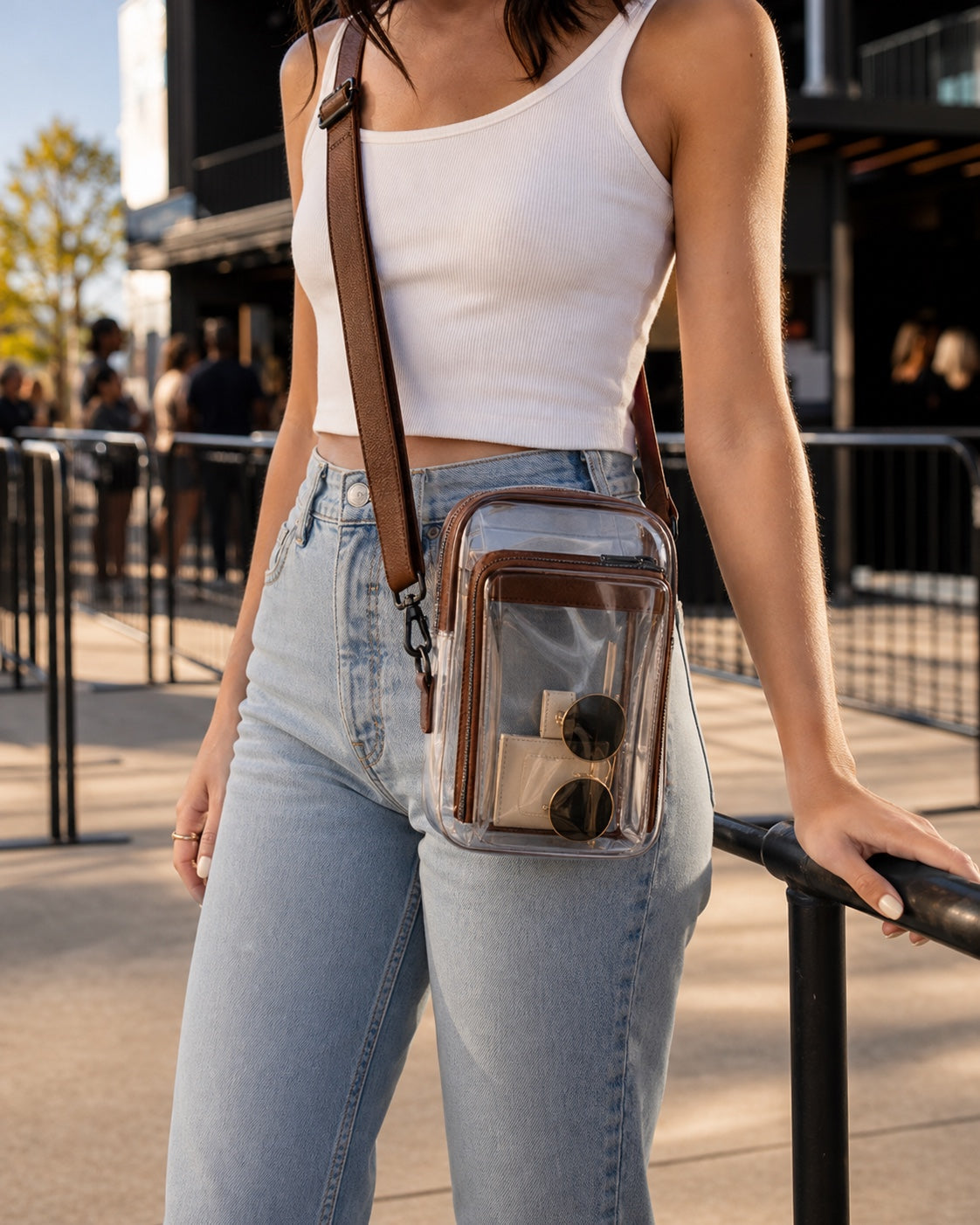 Clear crossbody bag styled with a summer outfit outside a music venue